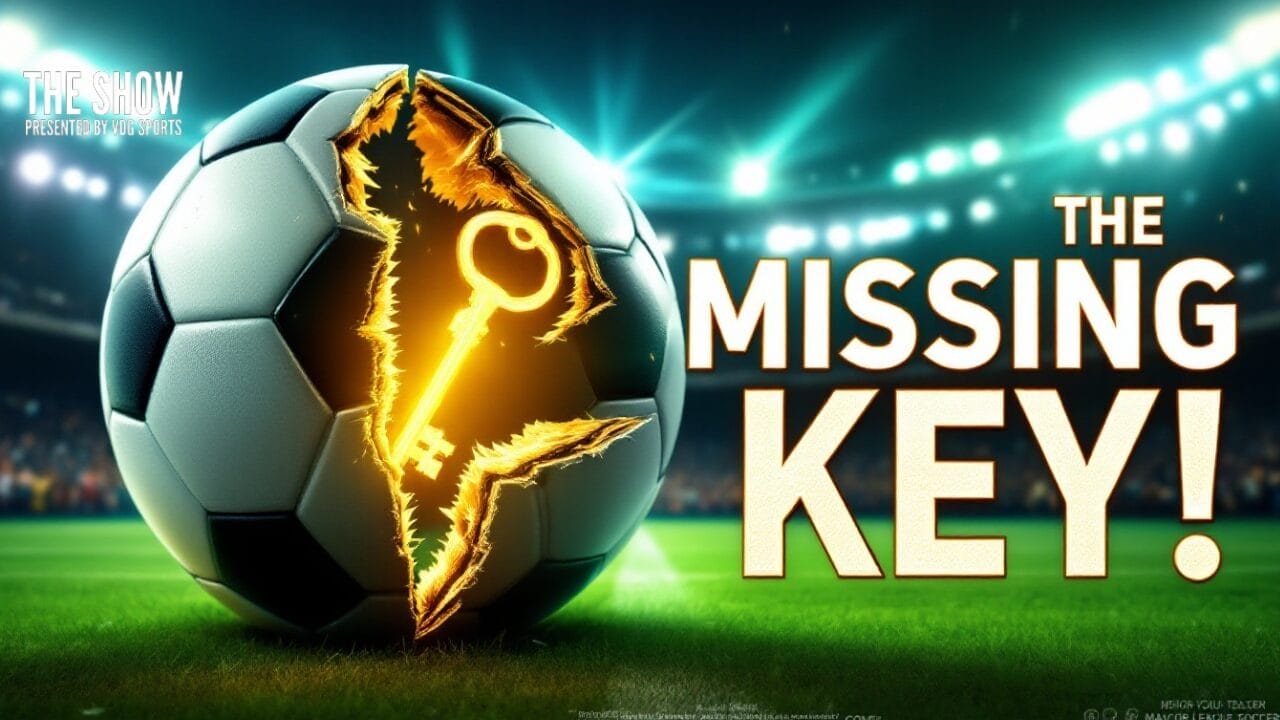A football with a glowing, jagged crack revealing a golden key sits on the stadium field. Large text on the right reads, “THE MISSING KEY!” Stadium lights shine over a blurred crowd. Smaller text says, “THE SHOW PRESENTED BY EA SPORTS—MLS one thing.”.