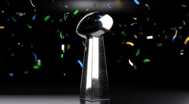 A shiny silver trophy with colorful confetti cascading around it stands against a dark background, celebrating the thrilling excitement of NFL Super Wildcard weekend.