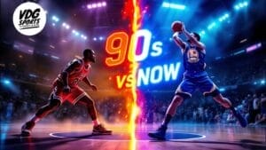 A basketball player in a red jersey faces off against a player in blue on the court. The scene, split by "90s vs Now" text, playfully nods to debates over the worst NBA era. Lights and audience animate the background, while the VDG Sports logo graces the top left corner.