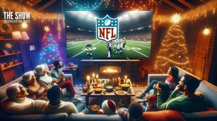 A group of people sitting on couches in a living room decorated with Christmas lights and a tree, watching an NFL game on a large TV above a lit fireplace. The room is warm and festive, with snacks and drinks on the table.