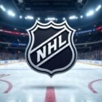 A large NHL logo floats over the center of an ice hockey rink inside a brightly lit arena with empty seats and surrounding boards, highlighting the professional league as nhl viewership compared to other sports continues to spark interest.