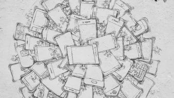 A street art mural shows a bomb made of tangled smartphones, with tiny figures crawling on them—perhaps hinting at why ESPN is losing viewers. An unlit fuse sits atop, while a Wi-Fi symbol and a small heart are drawn on the white, textured wall.